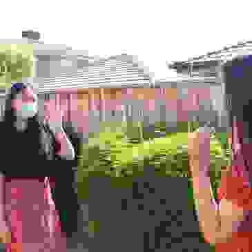 Girl wearing mask waving