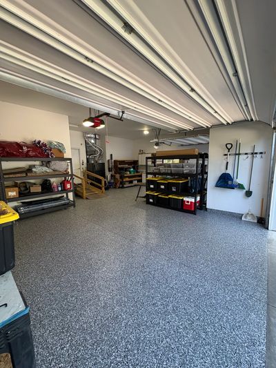 Clean and organized garage space with storage shelves.