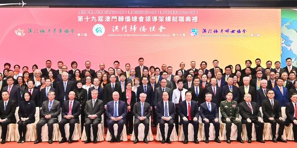 Group photo of officials and delegates at a formal conference event.