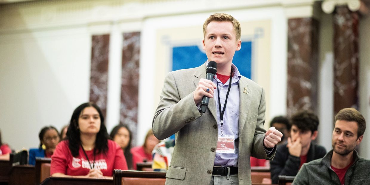 Kyle giving a speech at the Newman Civic Fellow Convening at the Edward Kennedy Institute for bi-par