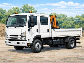 White flatbed truck with crane on construction site.