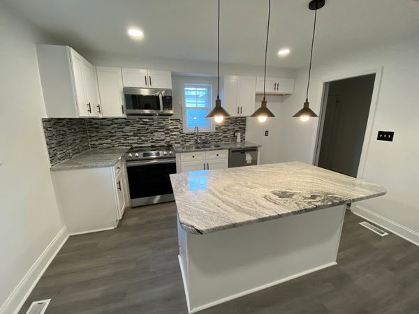 Kitchen Remodel Completed by MoHandymen with White Shaker Cabinets and Granite Countertops in Durham