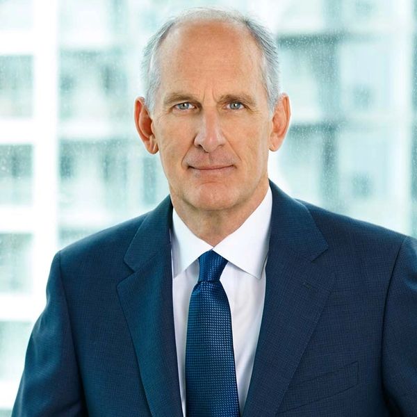 Mature man in a suit and tie.