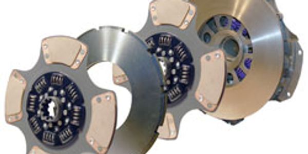 Three high-performance racing clutches with metallic components.