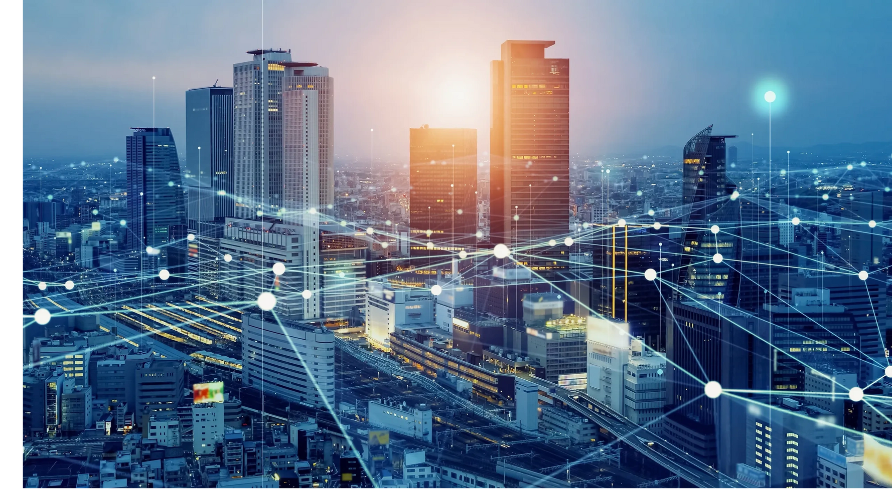 City skyline with digital network connections overlay at sunset.