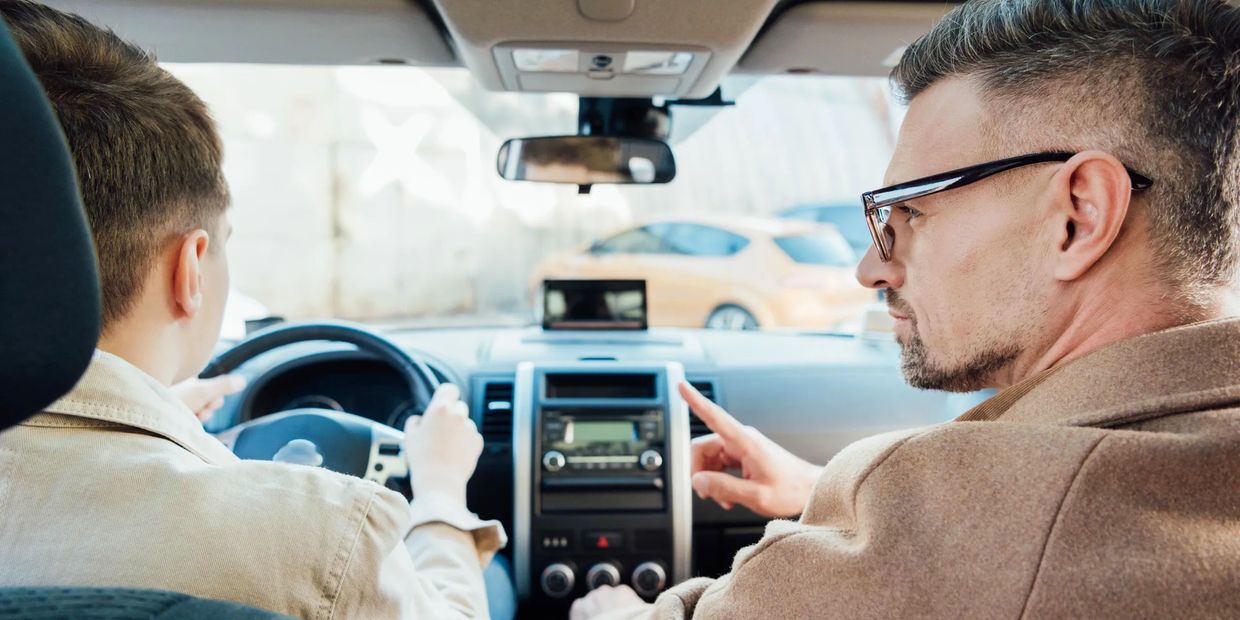 Father teaching teen son to drive – Texas Parent-Taught Driver’s Ed course