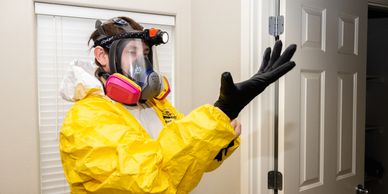 Picture of a man wearing a hazard suit. 