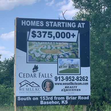 Real estate sign for Cedar Falls homes starting at $375,000+.