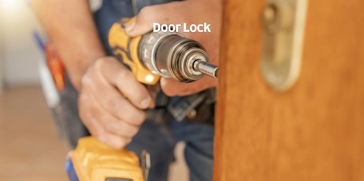 A person using a drill to install a door lock.