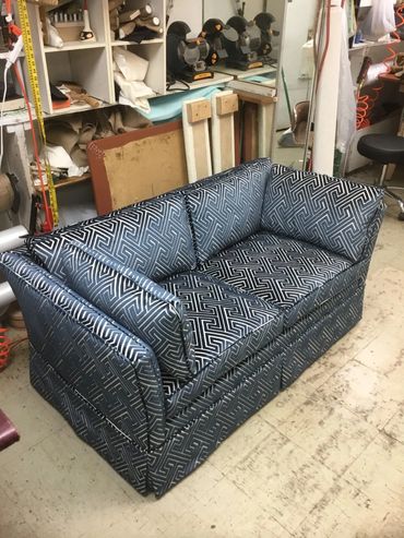 grey color sofa in a room