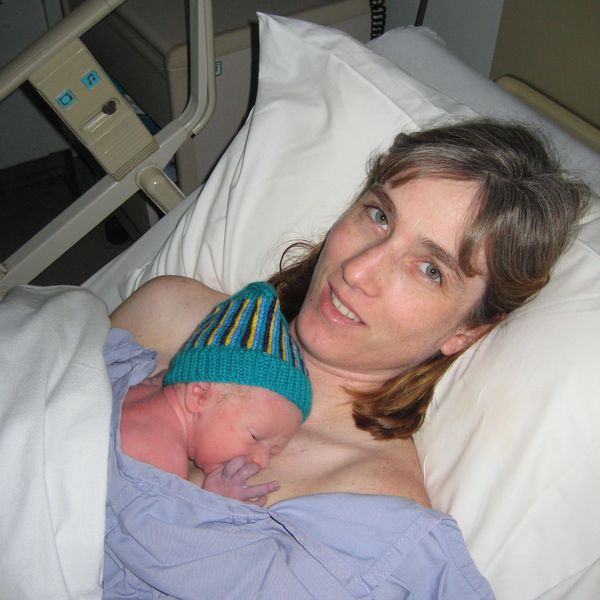 Sherri holding her son. Postpartum Birth Recovery Kangaroo Care Parent Mental Health  
