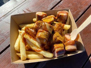 Currywurst served with chips