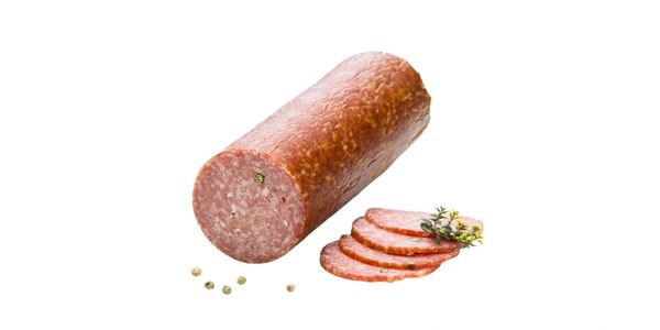 A whole and sliced smoked sausage with herbs and peppercorns.