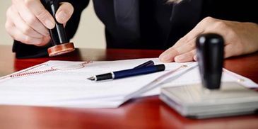 Woman stamping, dark blazer