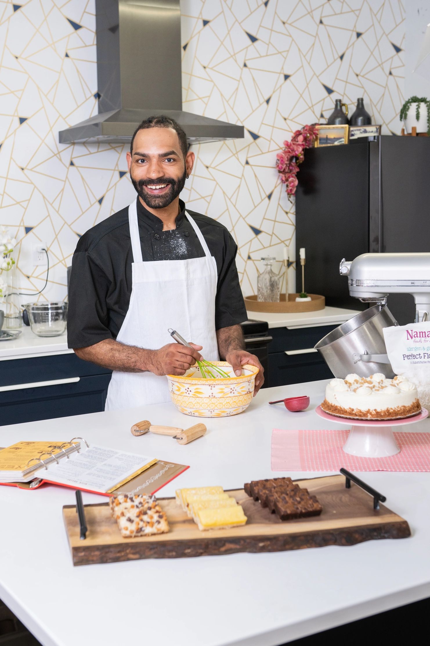 A man making cakes and pastries in the kitchen