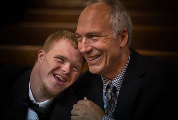 Two men sharing a joyful moment together.