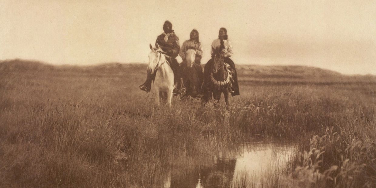 Old photograph of three Native Americans on horses circa 1800's.