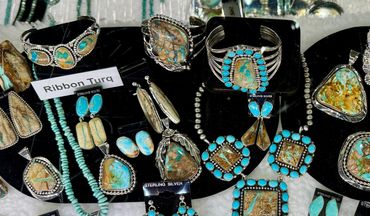 Collection of turquoise and silver jewelry pieces.