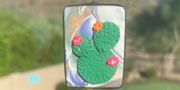 Embracing the prickly side of Arizona... clay pendant with raised succulents 