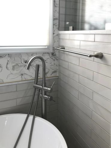 Modern bathroom faucet and towel rack.