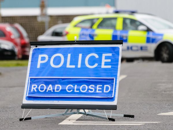 A Police Road Closed sign