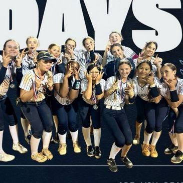 A girls' softball team posing with medals, celebrating victory.