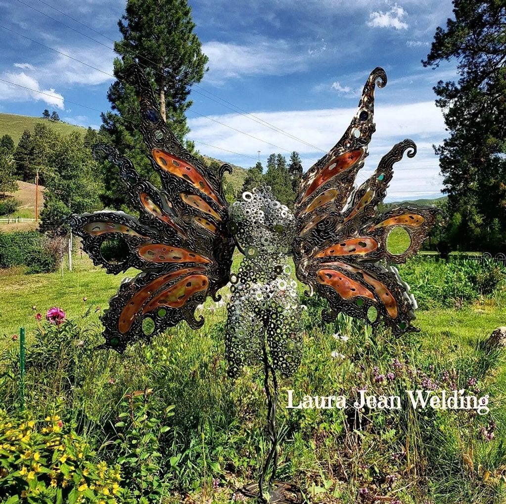 Enchanted metal wings: Steel, Copper, Stainless steel, mirror and glass sculpture artistry. 