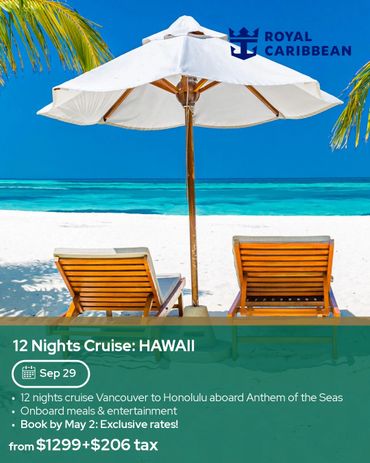 Beach chairs and umbrella on a tropical white sand beach with blue ocean and sky.