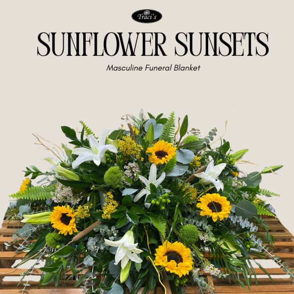 A vibrant masculine funeral blanket featuring sunflowers and white lilies.