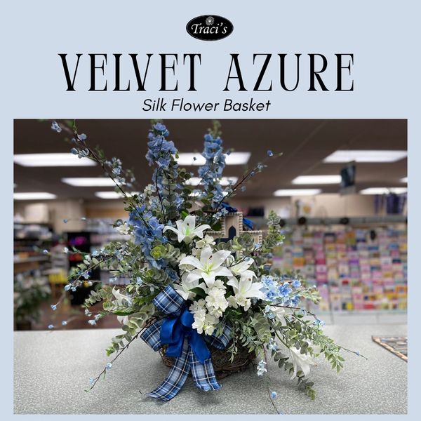 Elegant silk flower basket with blue and white blooms and plaid ribbon.