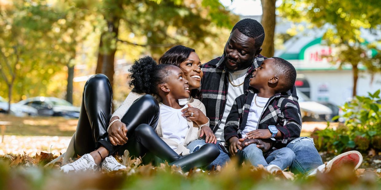 Happy family enjoying a moment together outdoors in autumn.