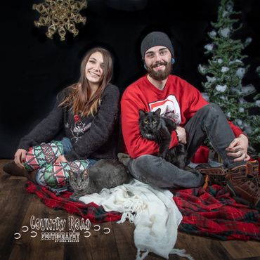 Couple with their cats in Christmas theme.