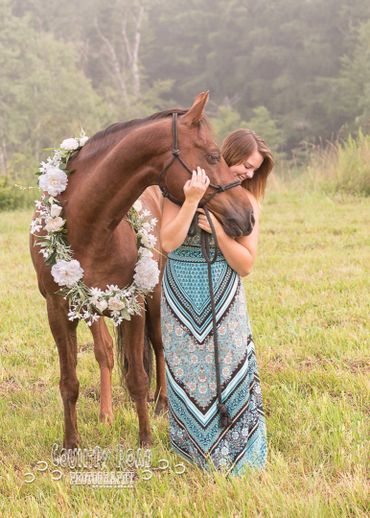 Horse and girl in field. 