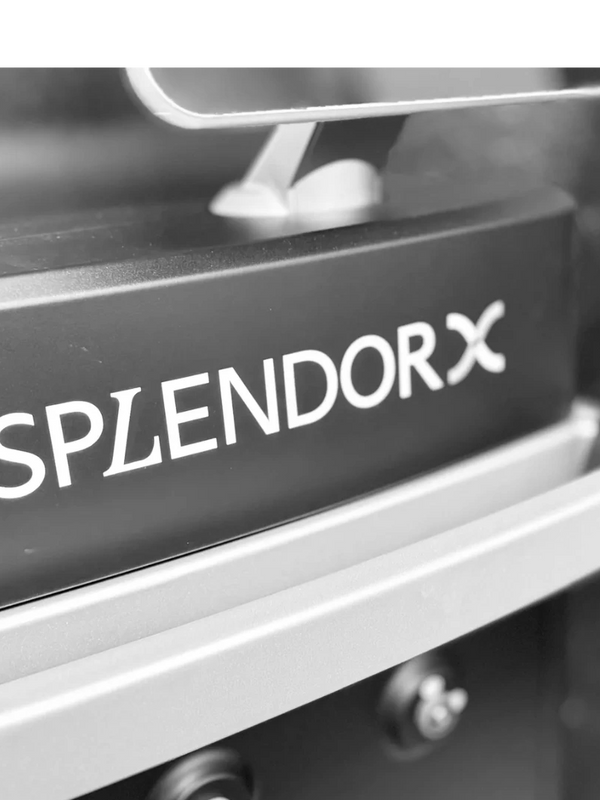 Close-up of a SplendorX machine with emergency stop button.