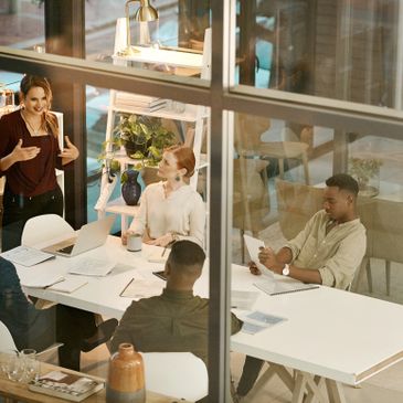 Team collaborating in a modern office meeting room.