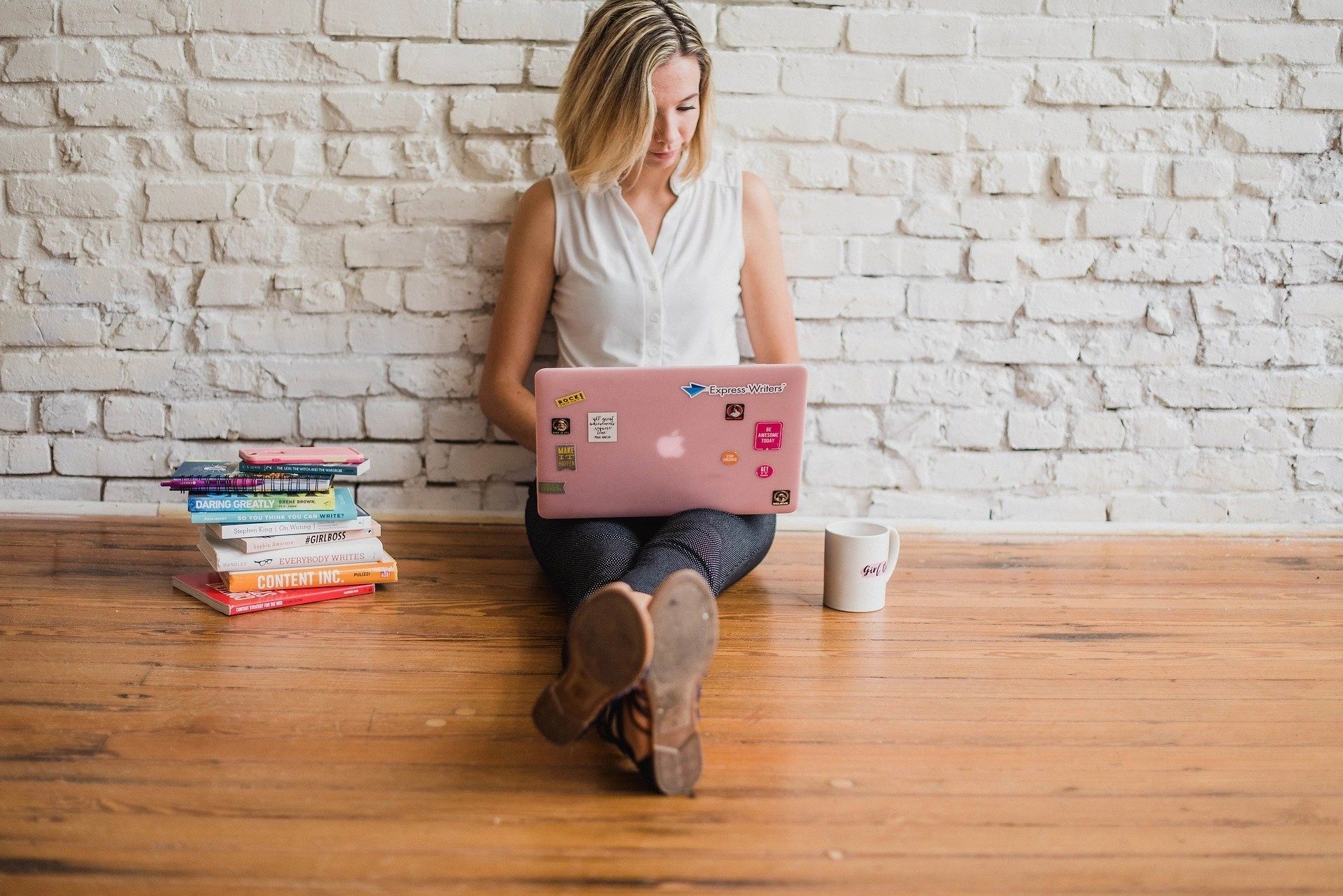 Mindock Counseling and Wellness Peoria IL Anxiety Counselor and Coach.  Woman on computer image.