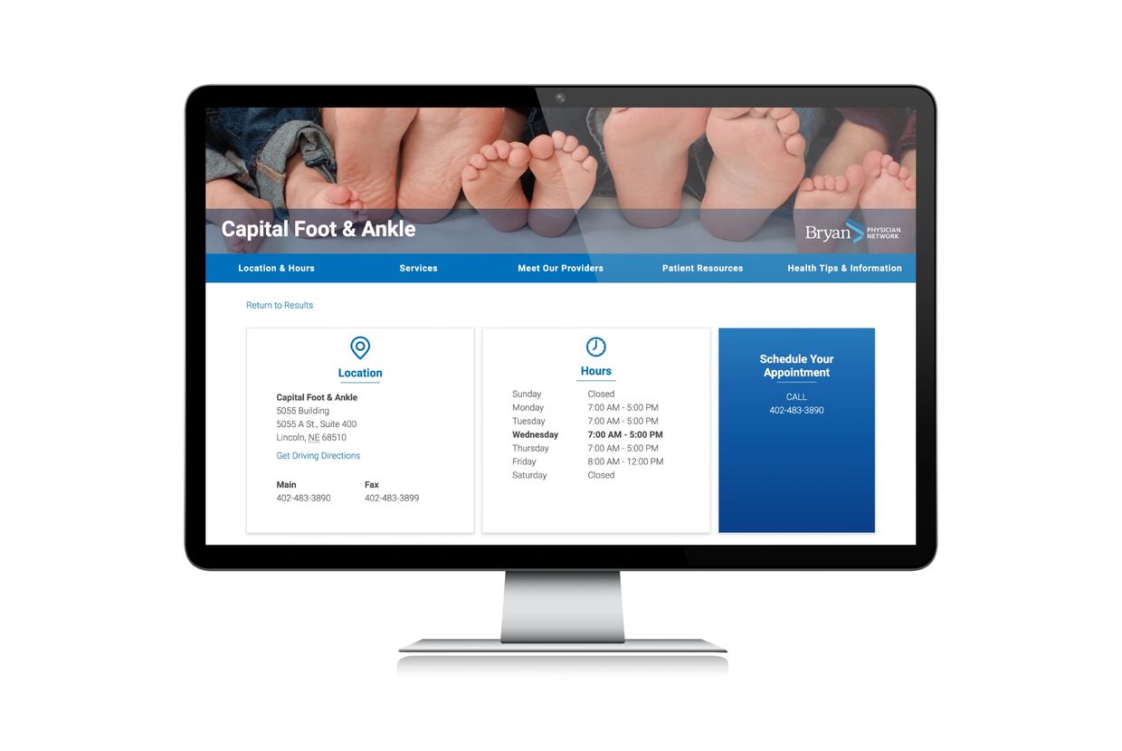 Bryan Health Capital Foot & Ankle page shown on large computer monitor.