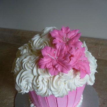 Giant cupcake smash cake with buttercream flowers. 