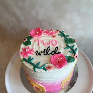 Two Wild theme kid's birthday cake with buttercream and fondant flowers. 
