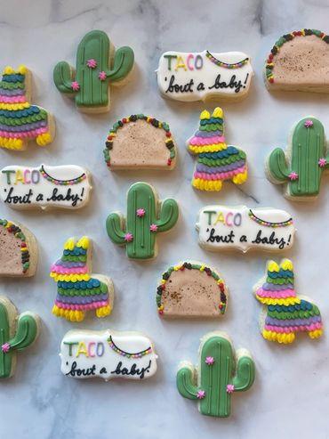 Fiesta themed sugar cookies with a taco, cactus and pinata. 