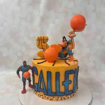 Basketball theme kid's cake in buttercream with ombre fondant letters and toys. 