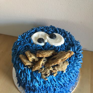 Cookie Monster theme round smash cake with real cookies. 