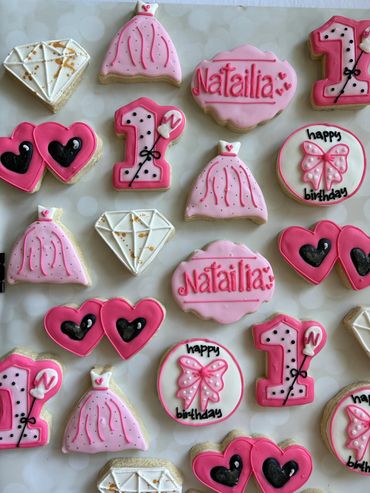 Barbie themed sugar cookies with lots of bright pink. 