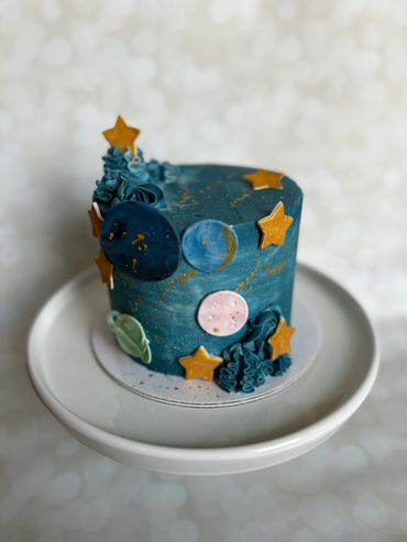 Space theme cake with fondant planet details. 