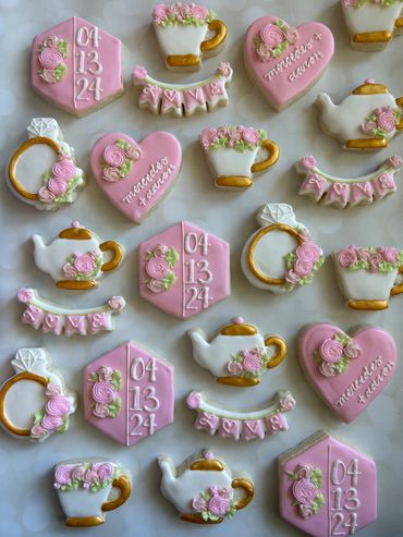 Tea party theme engagement cookies with a teapot, teacup and florals. 