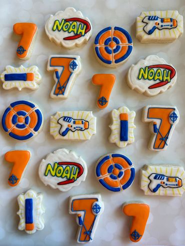 NERF themed sugar cookies with a target and darts. 