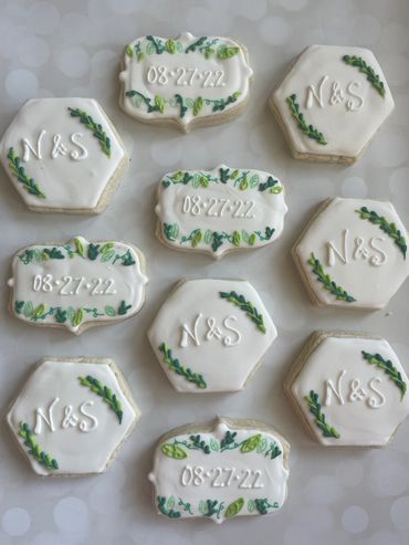 Green floral accent engagement cookies with edible marker greenery. 
