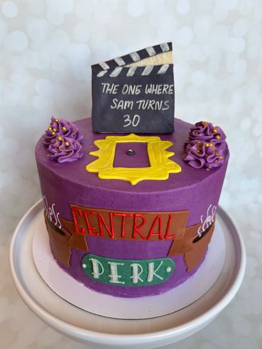 Friends theme birthday cake with sugar cookie topper and fondant details. 