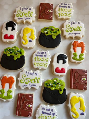 Hocus Pocus theme sugar cookies including a cauldron and book. 