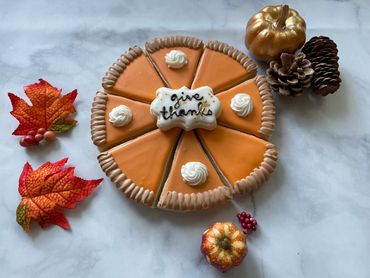 A pumpkin pie lookalike decorated sugar cookies. 